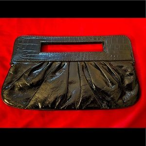 Black Patent Leather Clutch with animal print lining. Great condition!